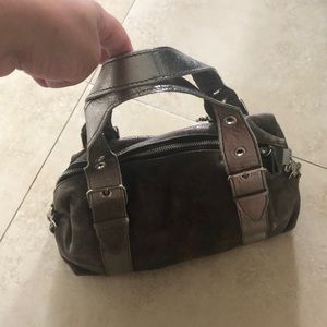 Tano handbags in metallic rust color with zipper